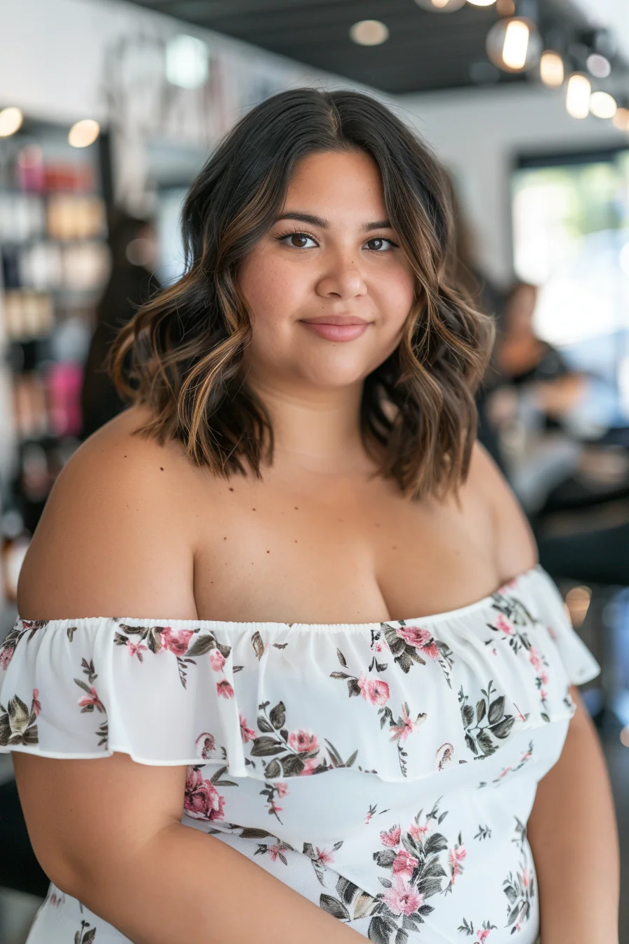 A shoulder-length bob with loose waves offers a classic yet modern look. The dark brown base with caramel highlights adds depth and dimension. This hairstyle enhances natural features and provides a soft, flattering frame for the face.